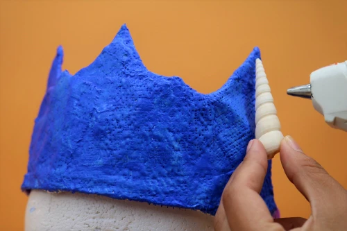 Glue seashells to a crown made with Rigid Wrap Plaster Cloth to create a gorgeous mermaid crown.